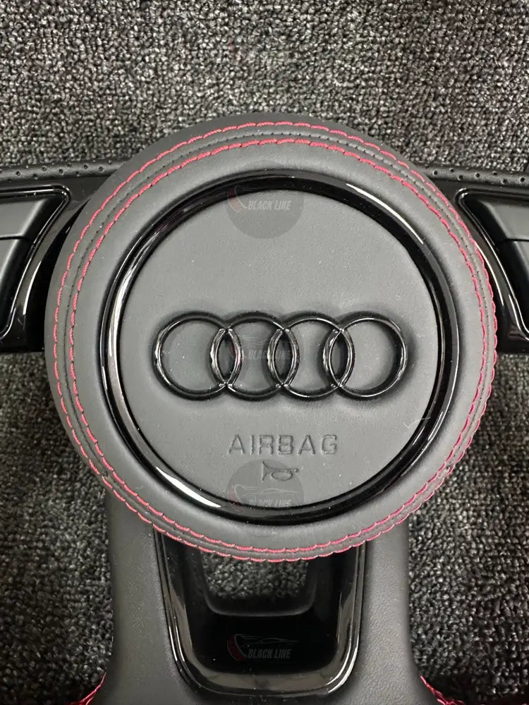 Volante Audi RS Deportivo en Negro Perforado con Levas Multifunción y Costuras Rojas