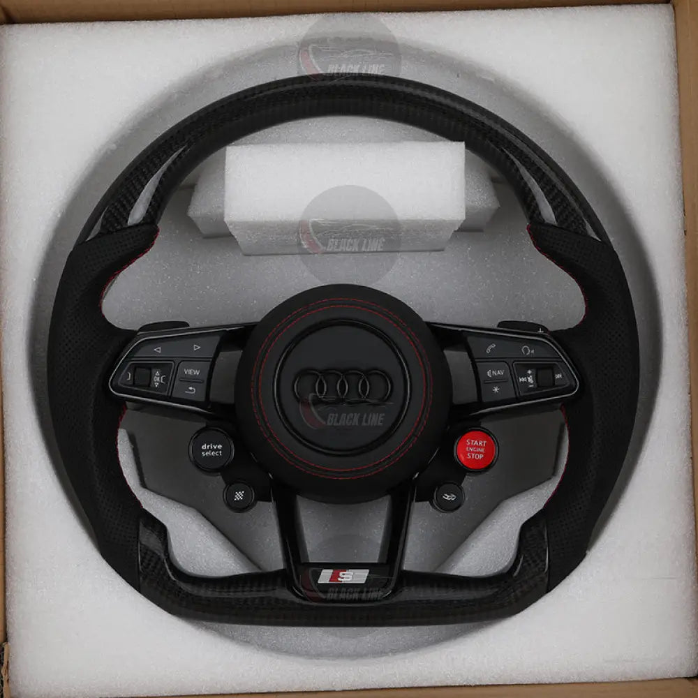 Volante Audi S deportivo en fibra de carbono cuero perforado y costuras rojas con airbag incluido