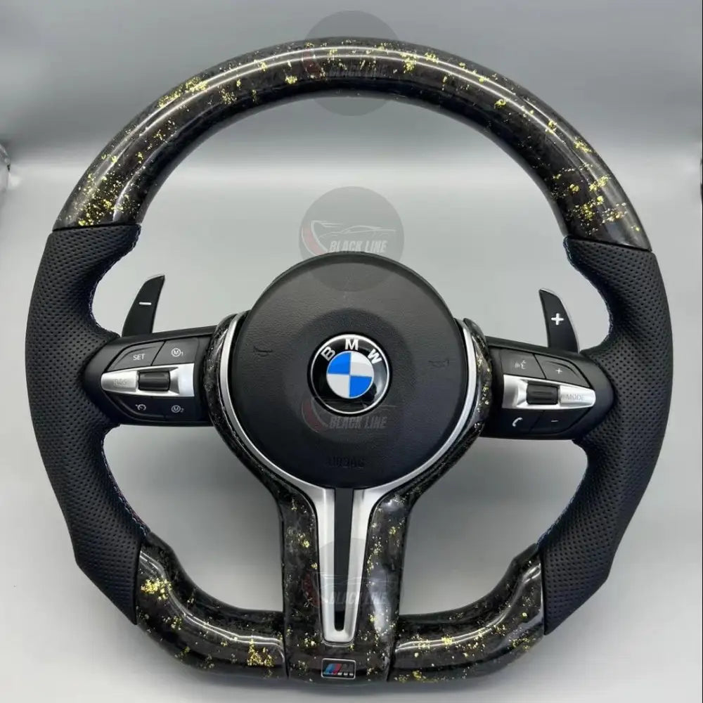 Volante BMW M Performance en Fibra de Carbono con Detalles Dorados Cuero Perforado Levas y M1/M2