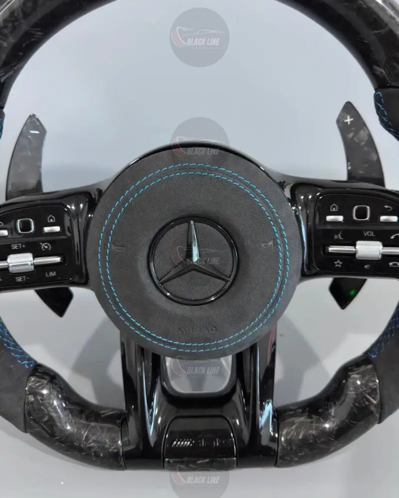 Volante Deportivo Mercedes-AMG de Carbono Forjado y Alcántara con Costura Azul Levas y Airbag Incluido