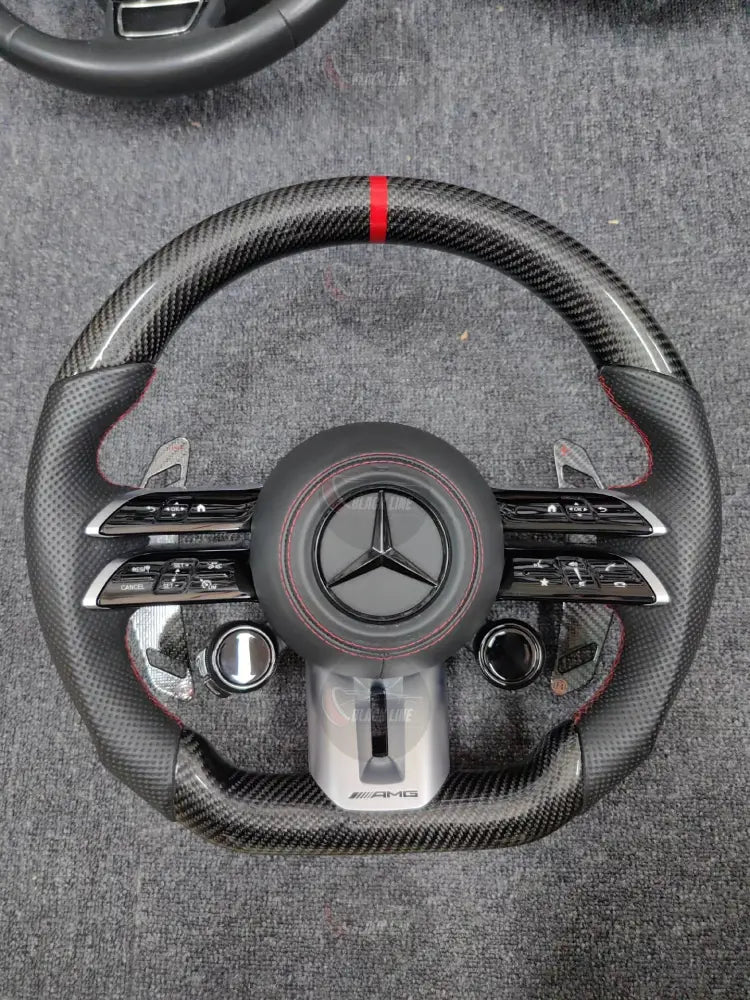 Volante Mercedes-AMG Performance en Fibra de Carbono con Microfibra Perforada Levas y Multifunción