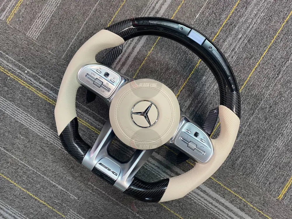 Volante Mercedes-AMG Performance en Fibra de Carbono Cuero Beige Perforado Pantalla y LED con Levas y Multifunción