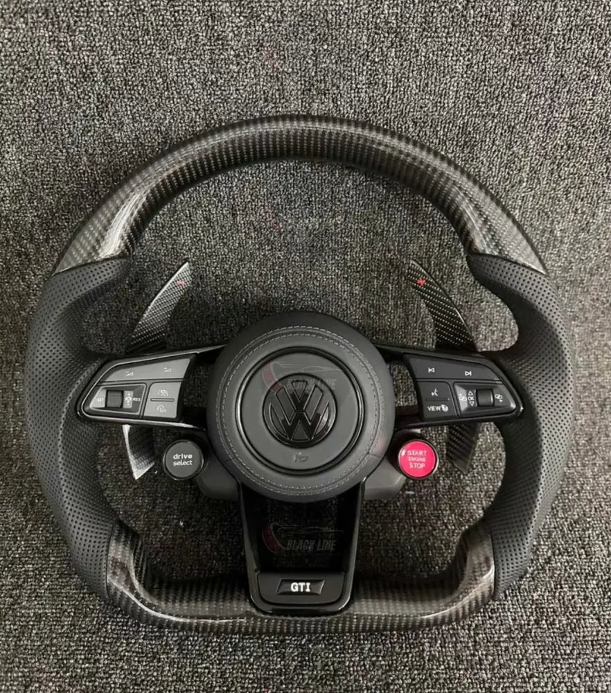 Volante Volkswagen GTI Deportivo en Fibra de Carbono y Piel Perforada | Levas de Carbono Drive Select Botón Start Fondo