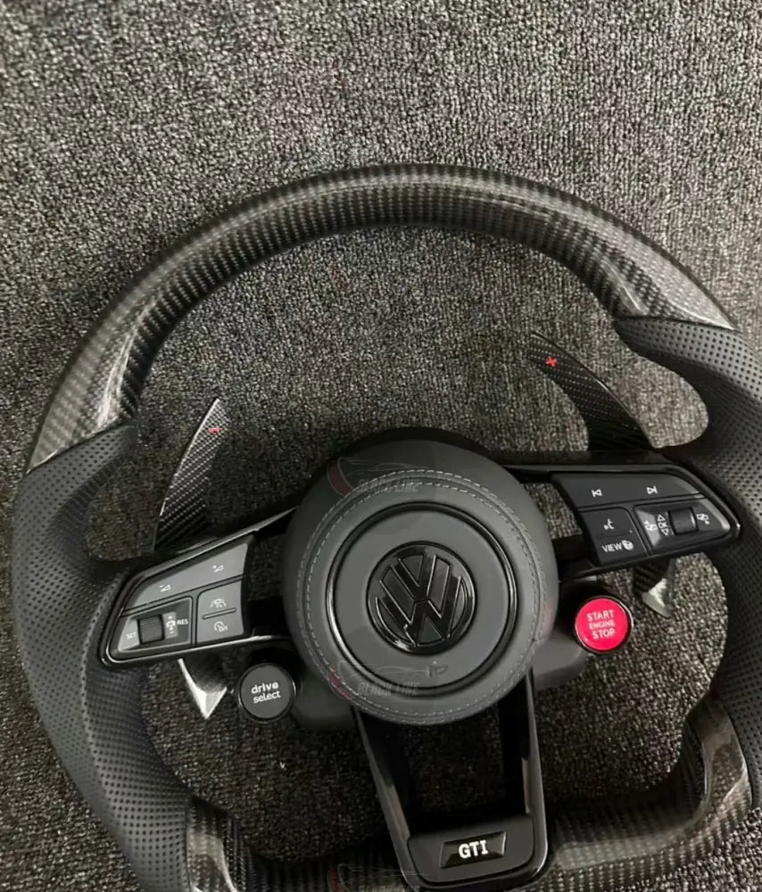 Volante Volkswagen GTI Deportivo en Fibra de Carbono y Piel Perforada | Levas de Carbono Drive Select Botón Start Fondo