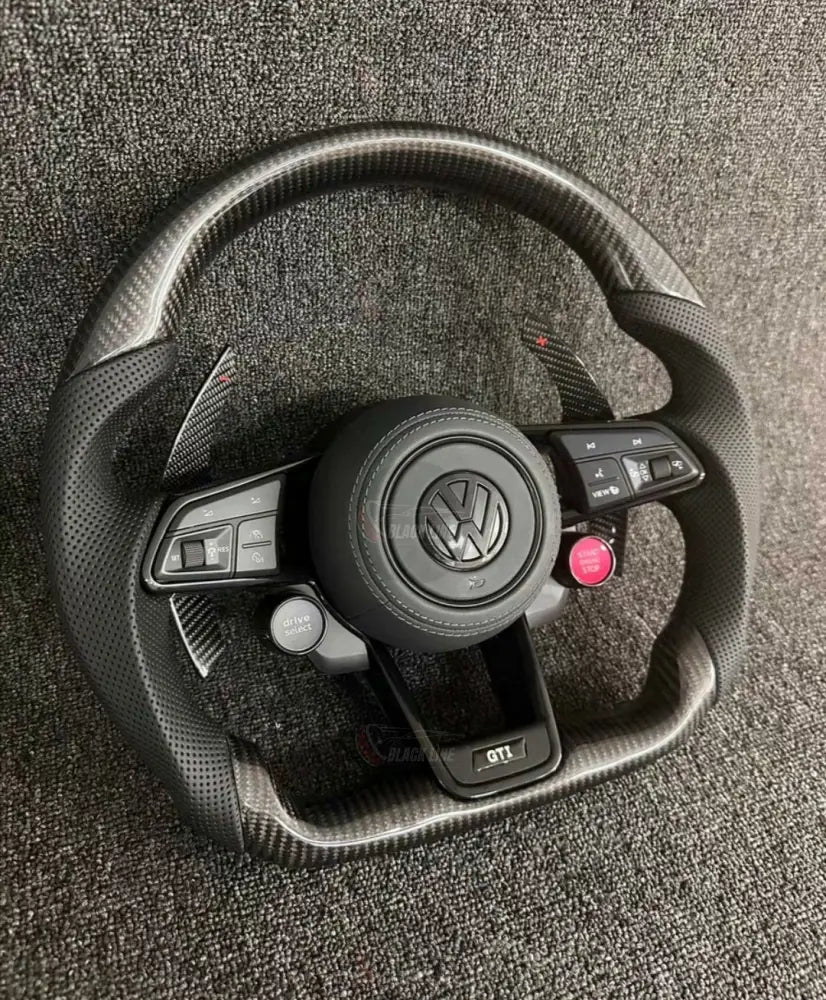 Volante Volkswagen GTI Deportivo en Fibra de Carbono y Piel Perforada | Levas de Carbono Drive Select Botón Start Fondo
